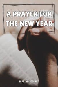 praying hands folded over an open Bible with overlaid text: "A Prayer for the New Year"